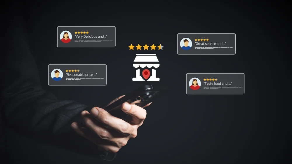 Small business owner checking customer reviews and star ratings on a smartphone