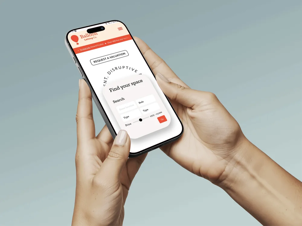 Balloon Lets property search shown on an iPhone held in two hands