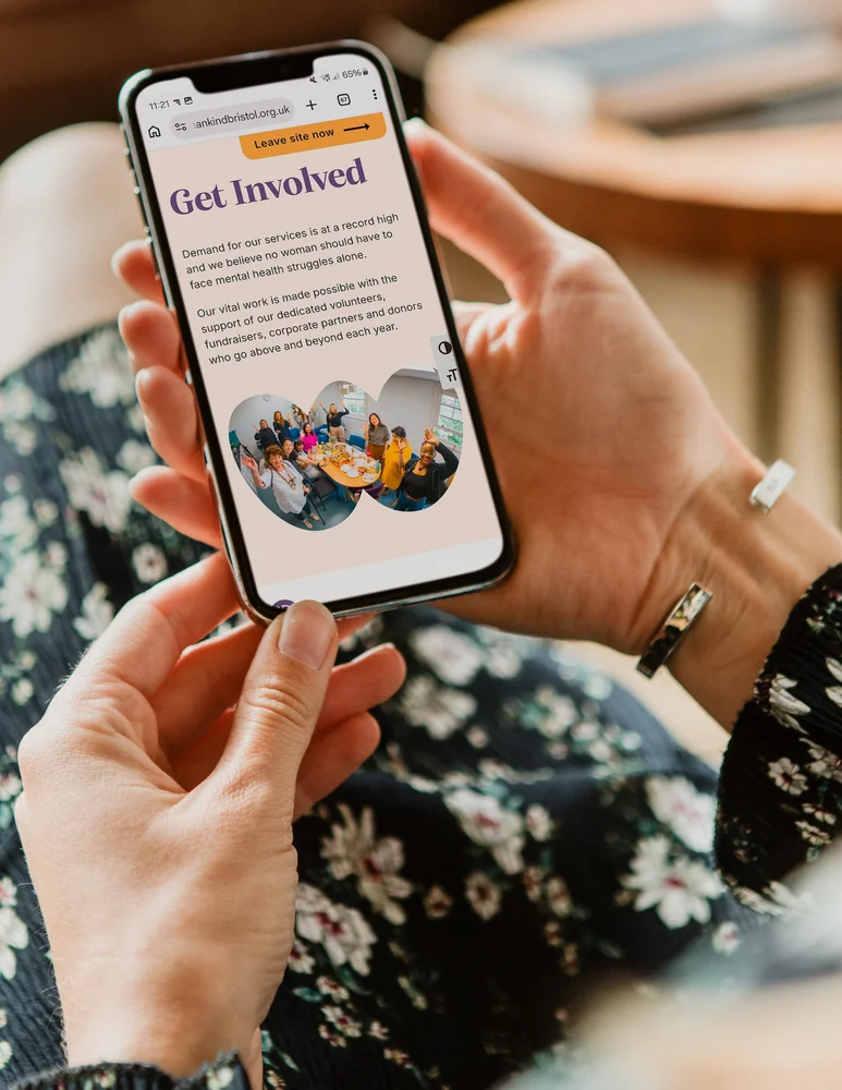 Person viewing the Womankind Bristol 'Get Involved' page on a smartphone